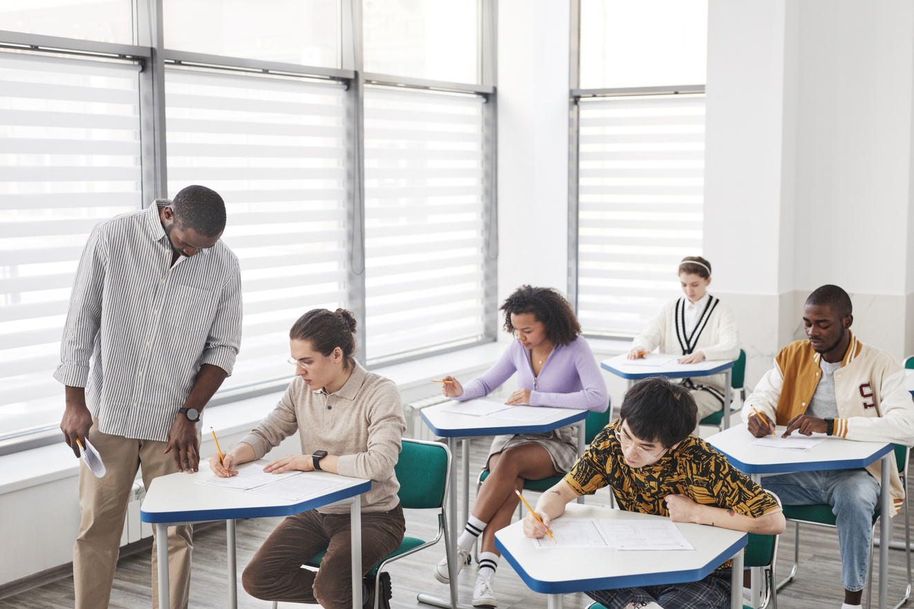 A Man Looking at His Students while Taking Exam